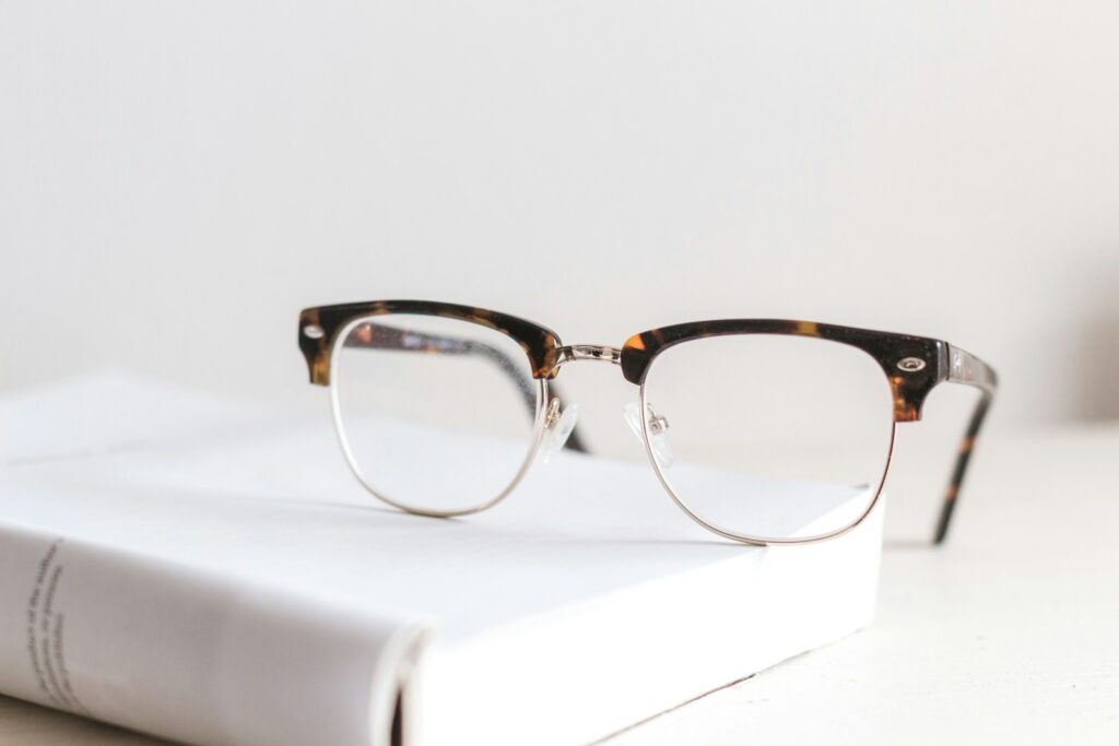 clear eyeglasses on book