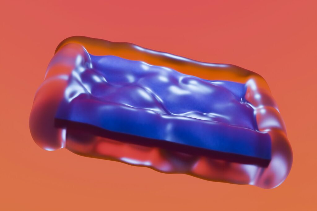 A close up of a blue and red object in the air