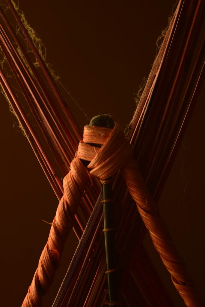 brown rope tied on brown wooden pole